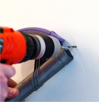 Suction from Vacuum captures dust during drilling